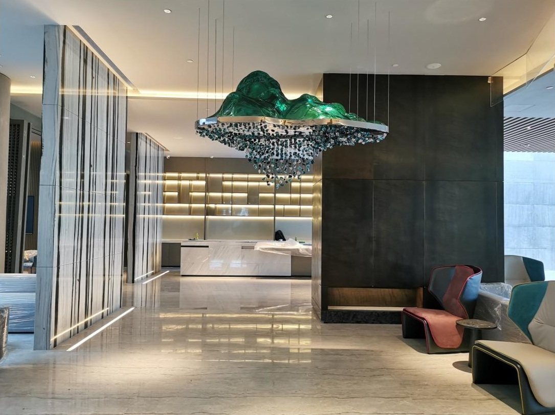 Green suspended feature artwork in the Crowne Plaza lobby