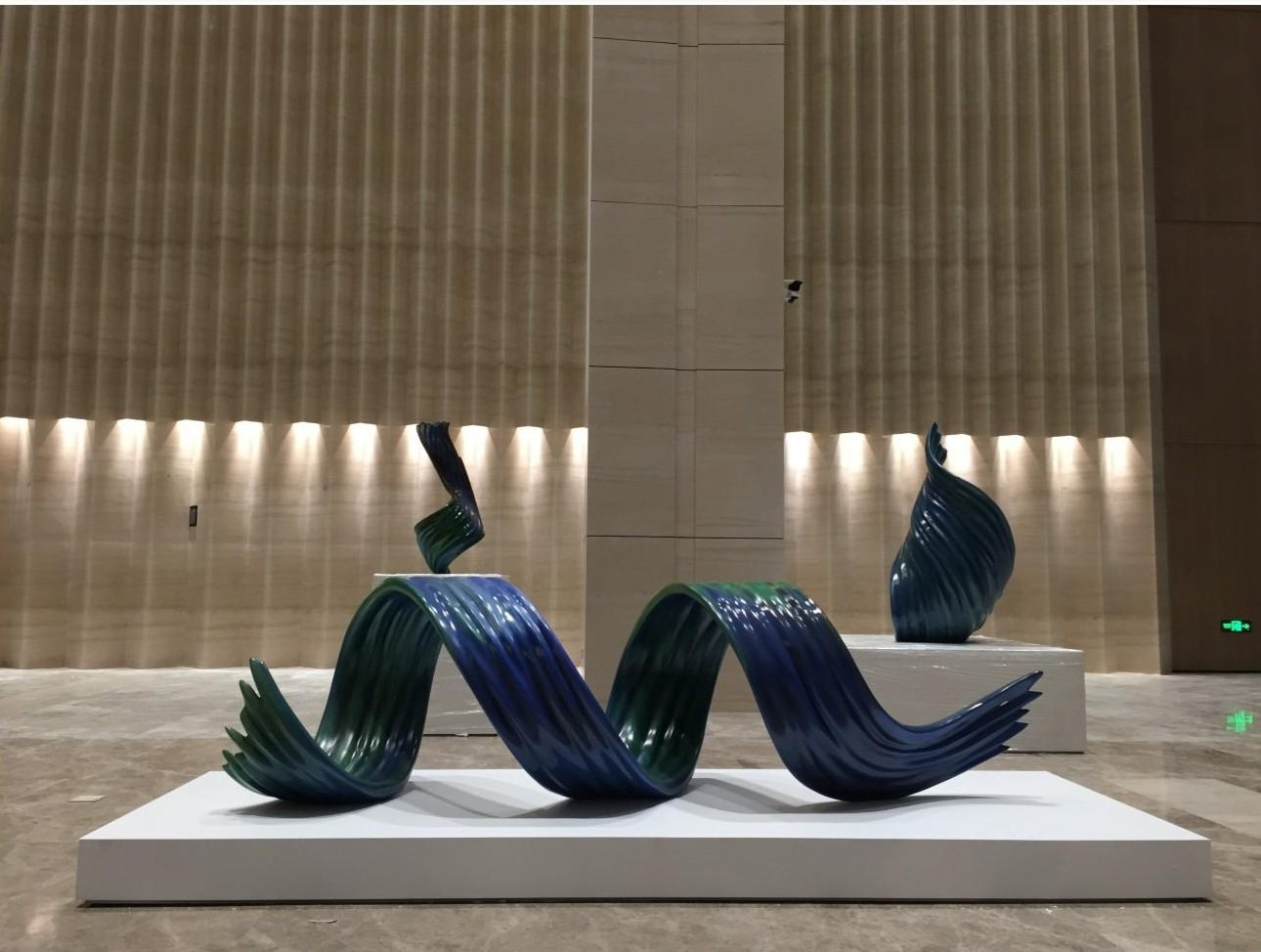 Blue curved sculpture in the Zhongxi Times Building interior
