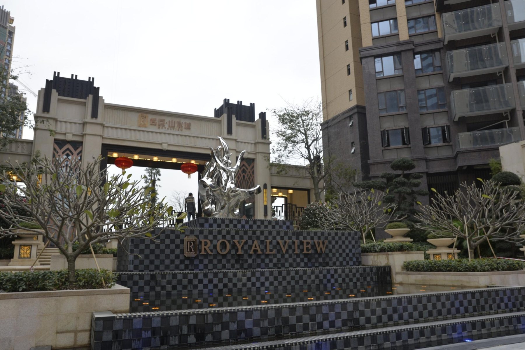 Outdoor sculpture along a planted pedestrian route