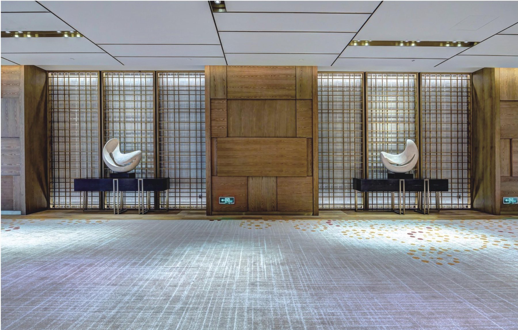 Paired white abstract sculptures in a Hyatt Regency corridor