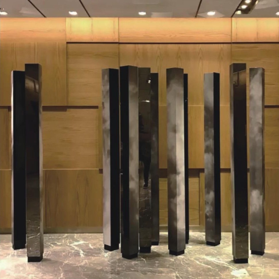 Tall dark sculptural elements in a hotel interior