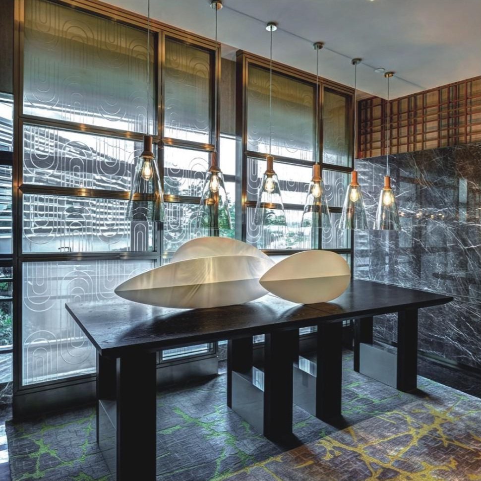 White abstract tabletop sculptures in a hotel interior
