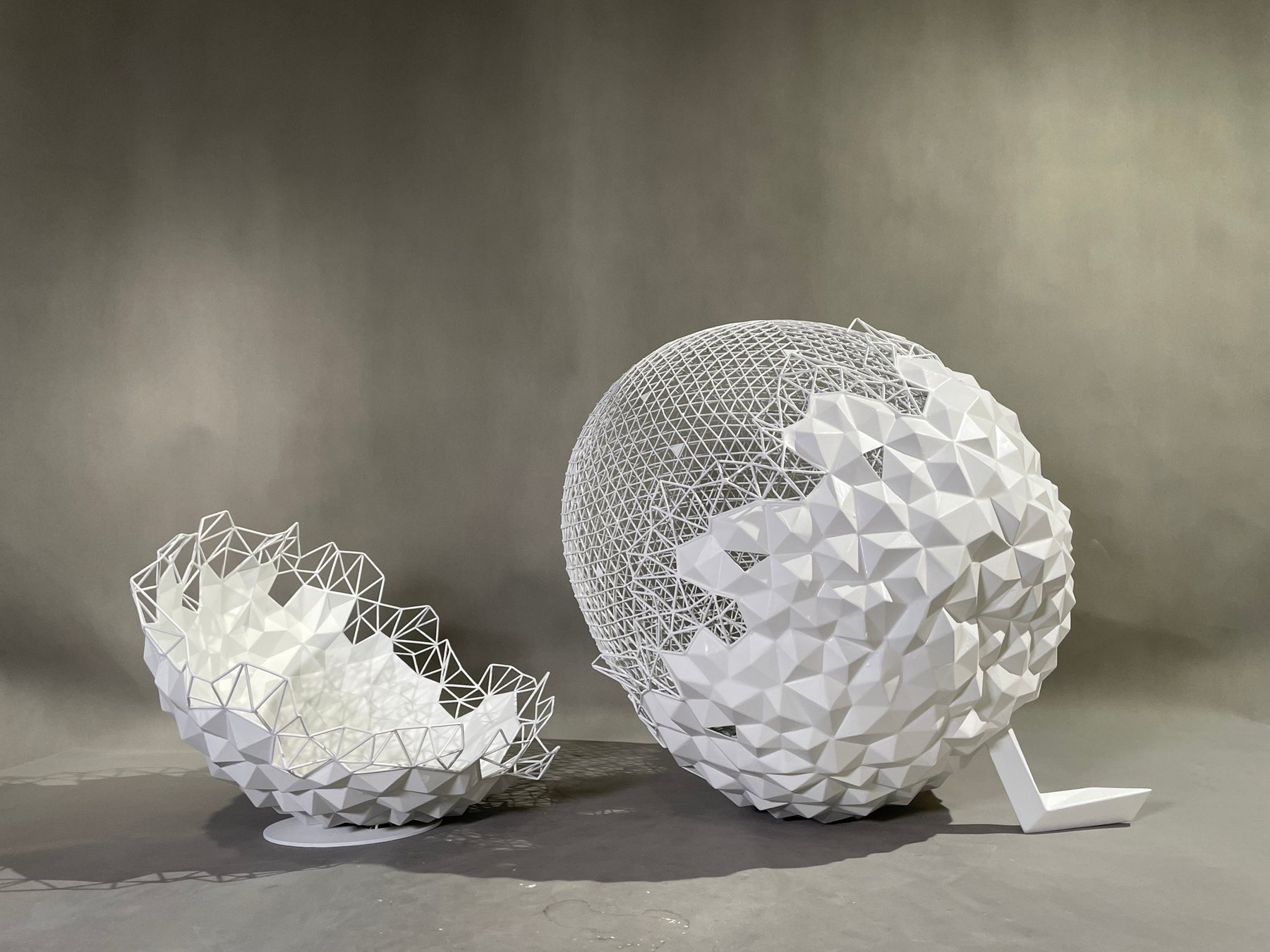 Paired wire and faceted spherical sculpture forms