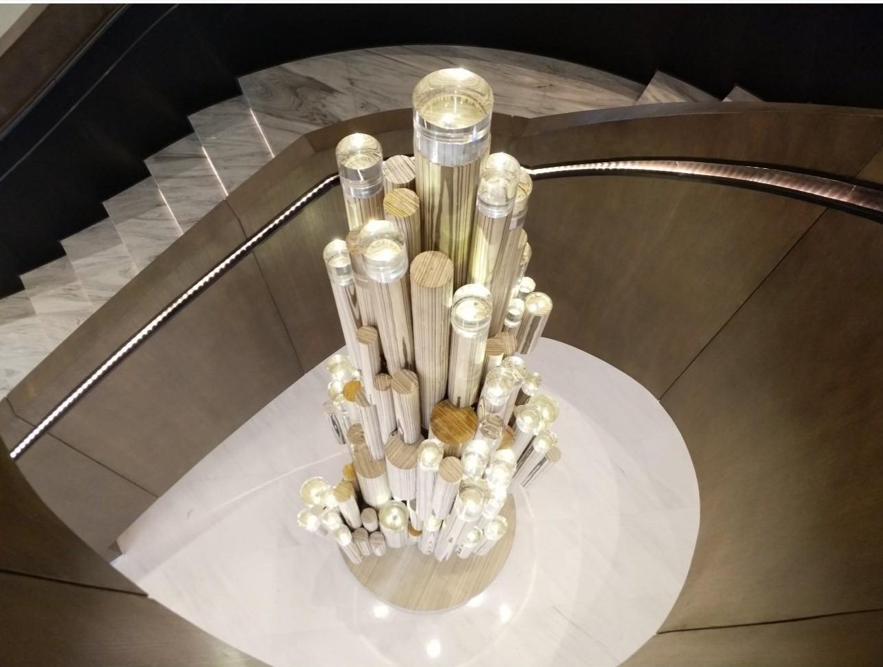 Illuminated vertical sculptural forms in a hotel interior