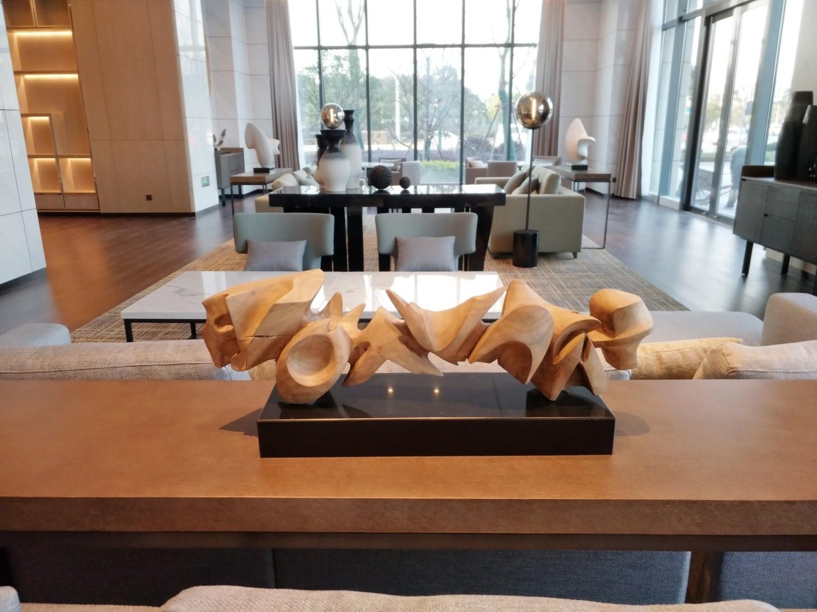 Compact abstract sculpture displayed on a hotel table