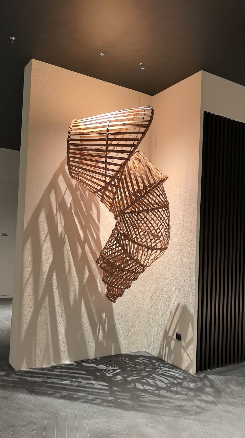 Slatted sculptural form projecting from a wall