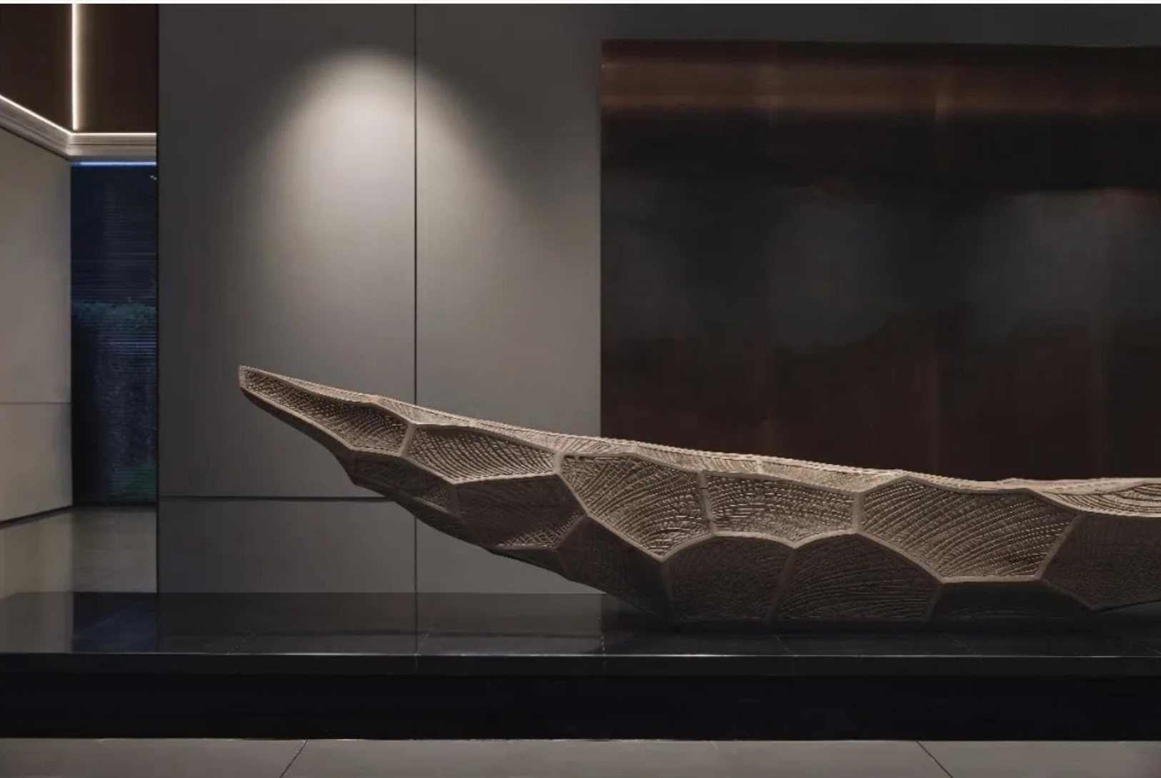 Side view of the faceted sales-gallery sculpture