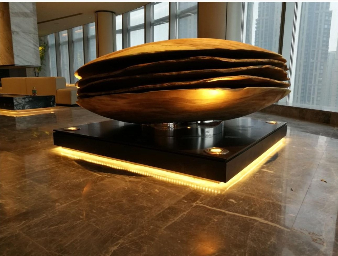 Close view of the warm-toned layered artwork