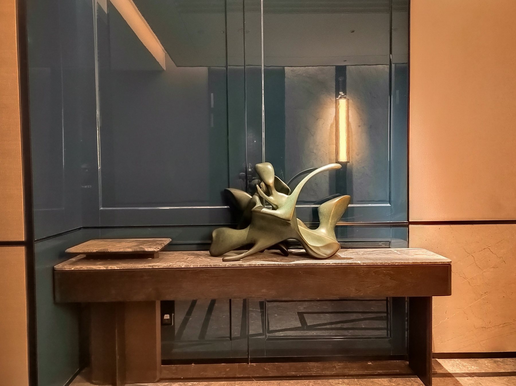 Green abstract sculpture in a hotel interior