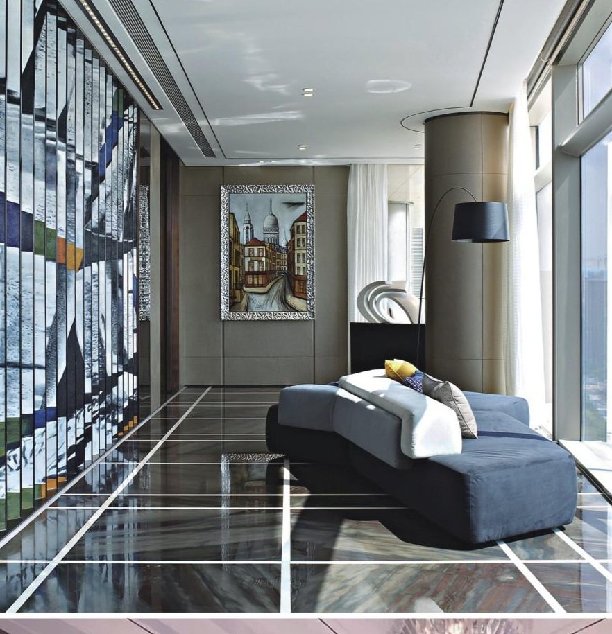 Artwork screen, framed art and sculpture coordinated in a bright lounge
